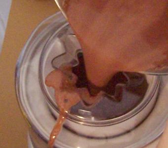 Pouring ice cream base into the machine
